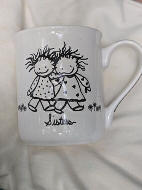 White 'Sisters' Illustrated Ceramic Mug - Black Artwork Enesco